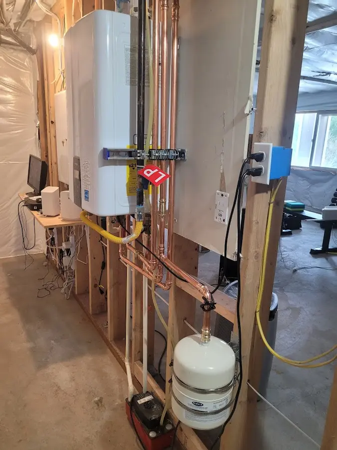 Licensed plumber repairing a kitchen sink in Freeport